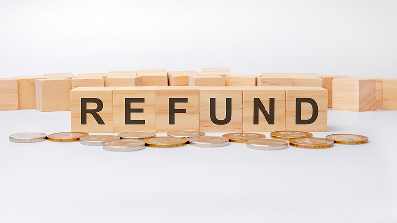 Refund written with wooden blocks