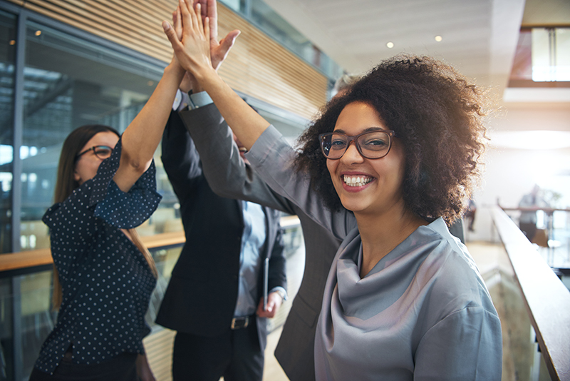 Professionals Giving High Fives