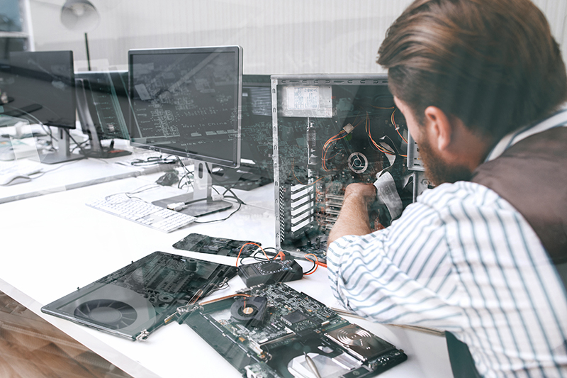 IT team member working on a computer