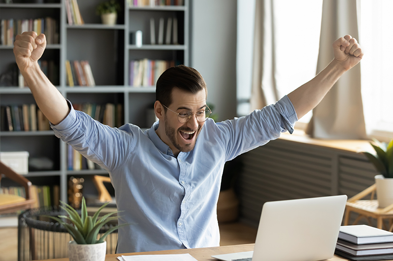 Man with hand up in victory