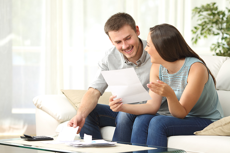 Happy Couple looking at a paperwork