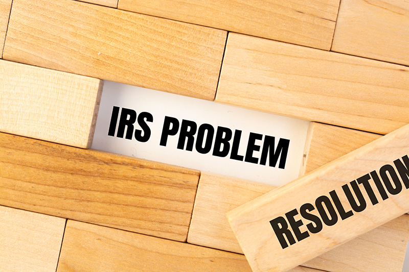 IRS Problem and Resolution written on wooden blocks