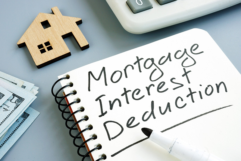 Mortgage Interest Deduction written on a Notebook