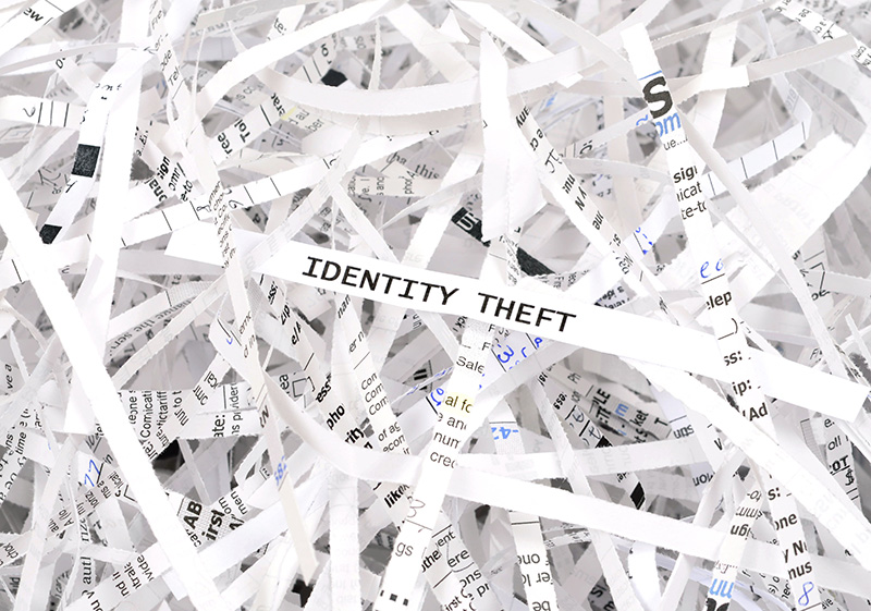Identity Theft written on Shredded Paper